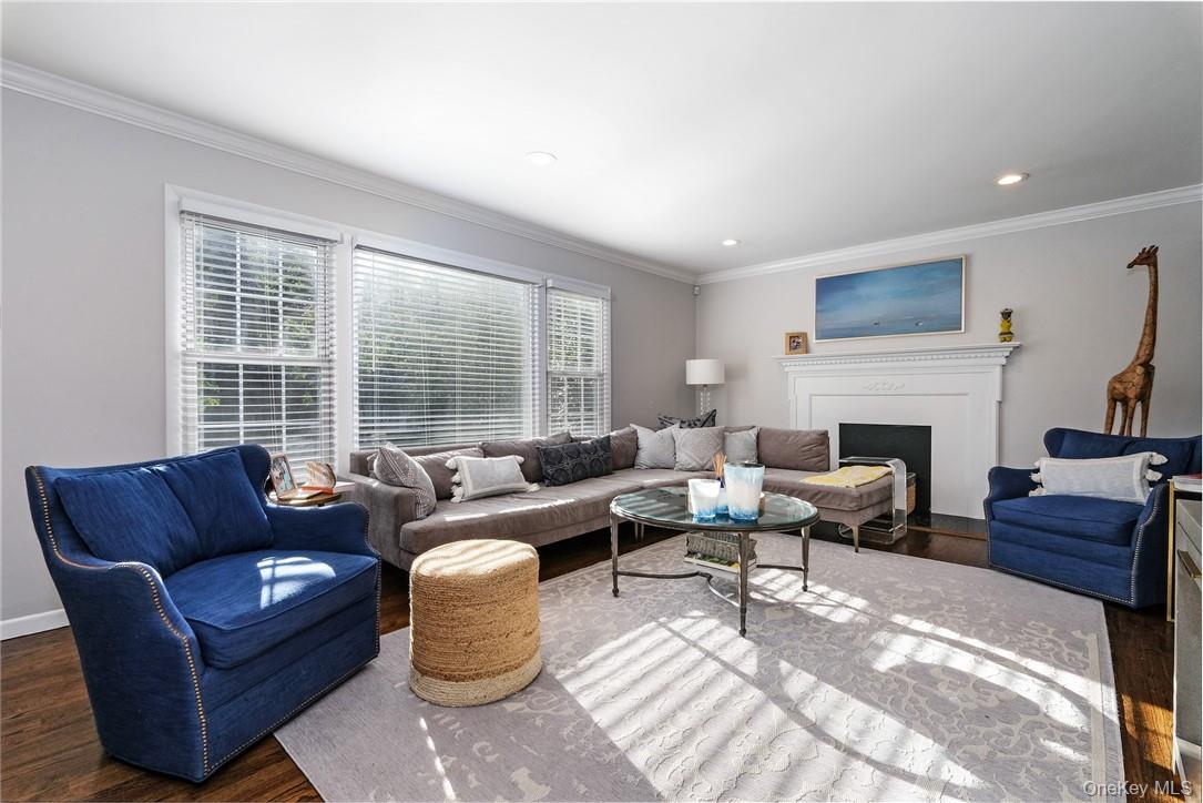 393 Milton Road Rye, NY 10580 - Photo 6 of 22 Spacious everyday living room with tucked away area for a desk. Decorative fireplace and mantle.