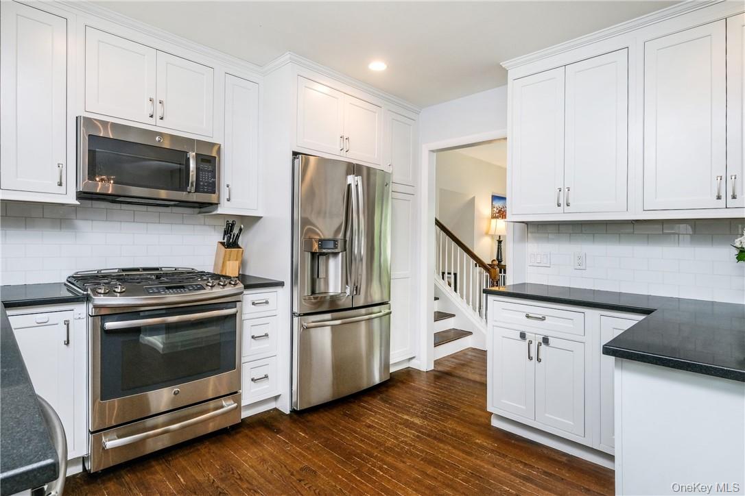 393 Milton Road Rye, NY 10580 - Photo 8 of 22 Updated kitchen features stainless steel appliances and custom cabinets. Kitchen door easy access to back deck.