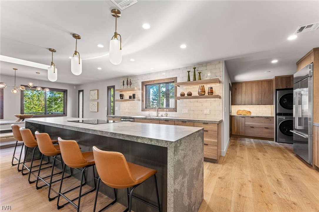 859 Tyner Way Incline Village, NV 89451 - Photo 12 of 33 a large kitchen with a table and chairs in it