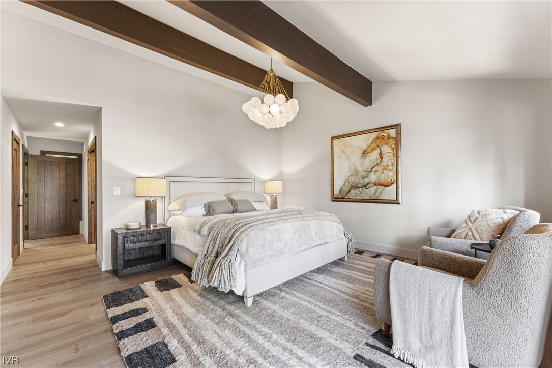 859 Tyner Way Incline Village, NV 89451 - Photo 14 of 33 a bedroom with a bed and wooden floor