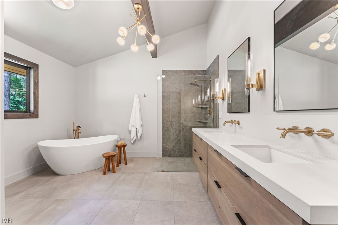 859 Tyner Way Incline Village, NV 89451 - Photo 15 of 33 a spacious bathroom with a sink double vanity tub and a mirror