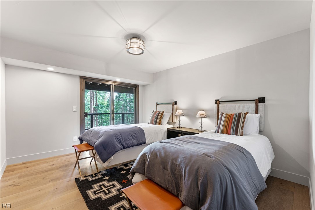 859 Tyner Way Incline Village, NV 89451 - Photo 22 of 33 a bedroom with two beds and a large window