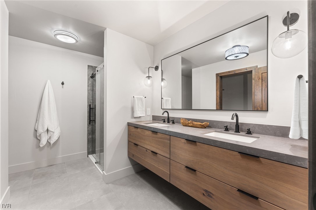 859 Tyner Way Incline Village, NV 89451 - Photo 23 of 33 a bathroom with a double vanity sink and a mirror