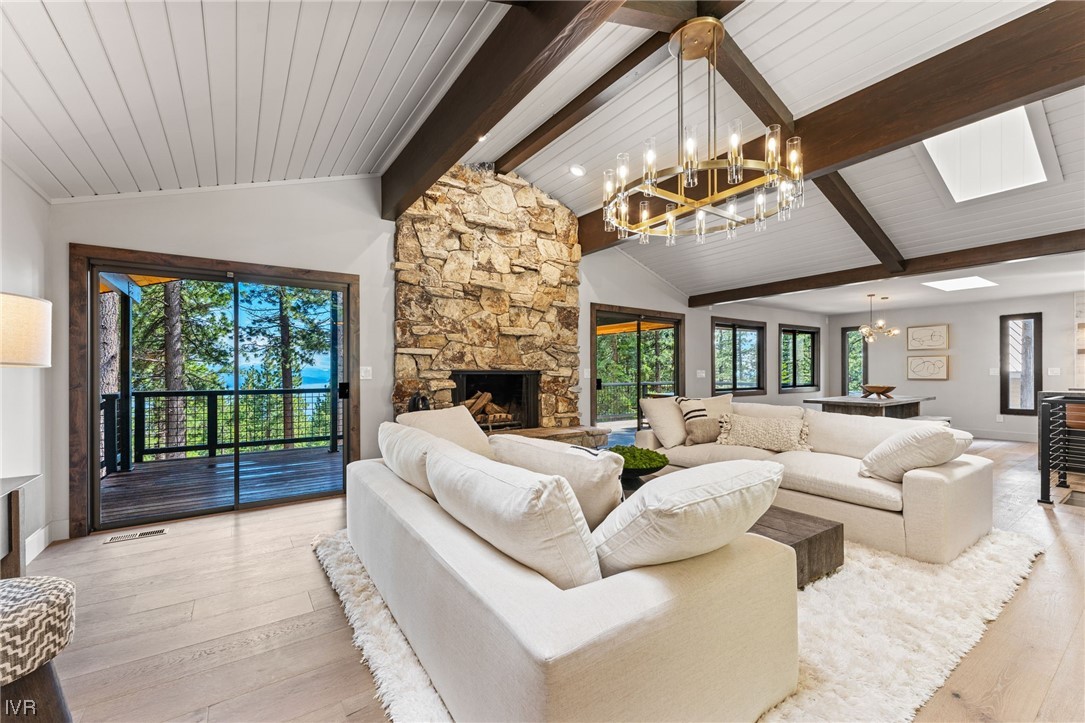 859 Tyner Way Incline Village, NV 89451 - Photo 6 of 33 a living room with furniture ceiling fan and a fireplace