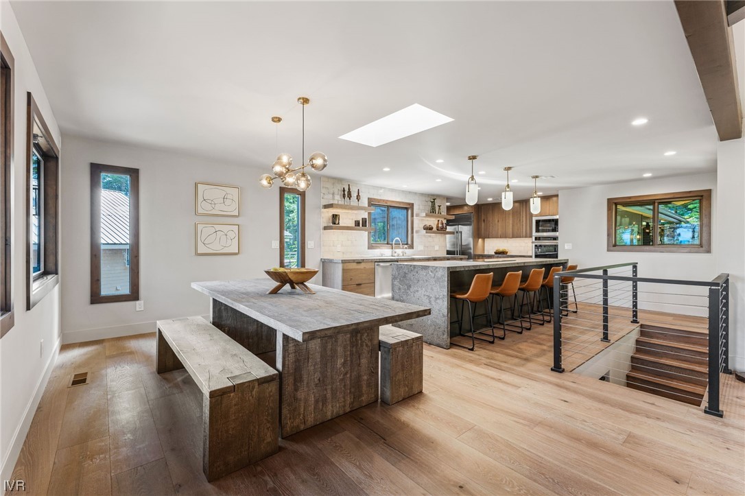 859 Tyner Way Incline Village, NV 89451 - Photo 8 of 33 a room with stainless steel appliances kitchen island granite countertop a table chairs and a refrigerator