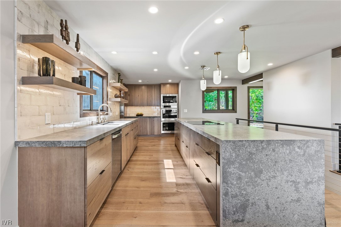 859 Tyner Way Incline Village, NV 89451 - Photo 10 of 33 a large kitchen with granite countertop a large counter top a sink stainless steel appliances and cabinets