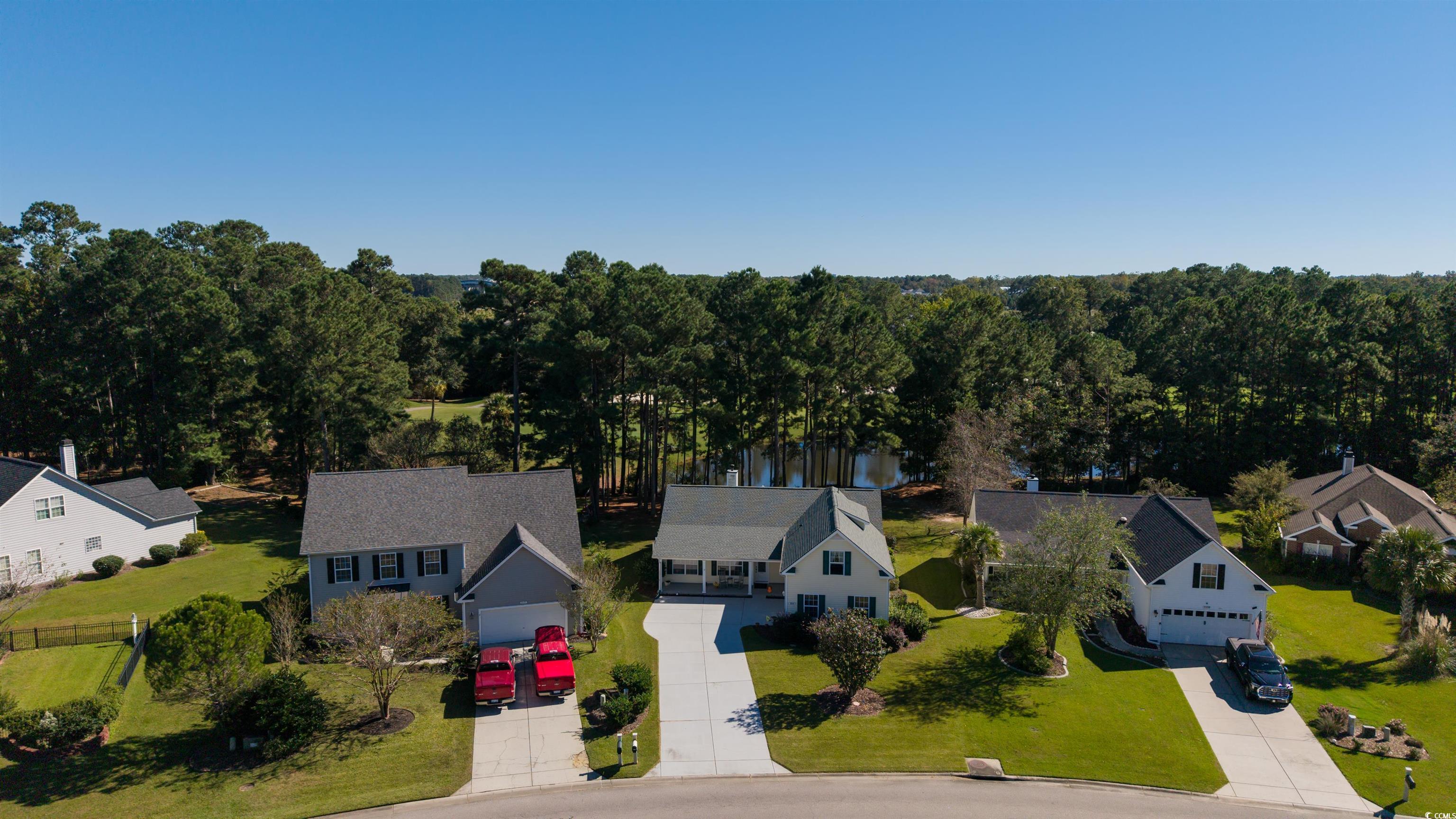 3505 Arrowhead Boulevard Myrtle Beach, SC 29579 - Photo 38 of 40 View from above of property with a large body of water and a tree filled landscape