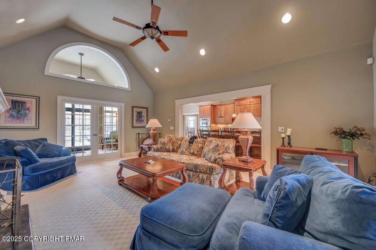 235 Wolf Hollow Road Lake Harmony, PA 18624 - Photo 16 of 98 a living room with furniture ceiling fan and a rug