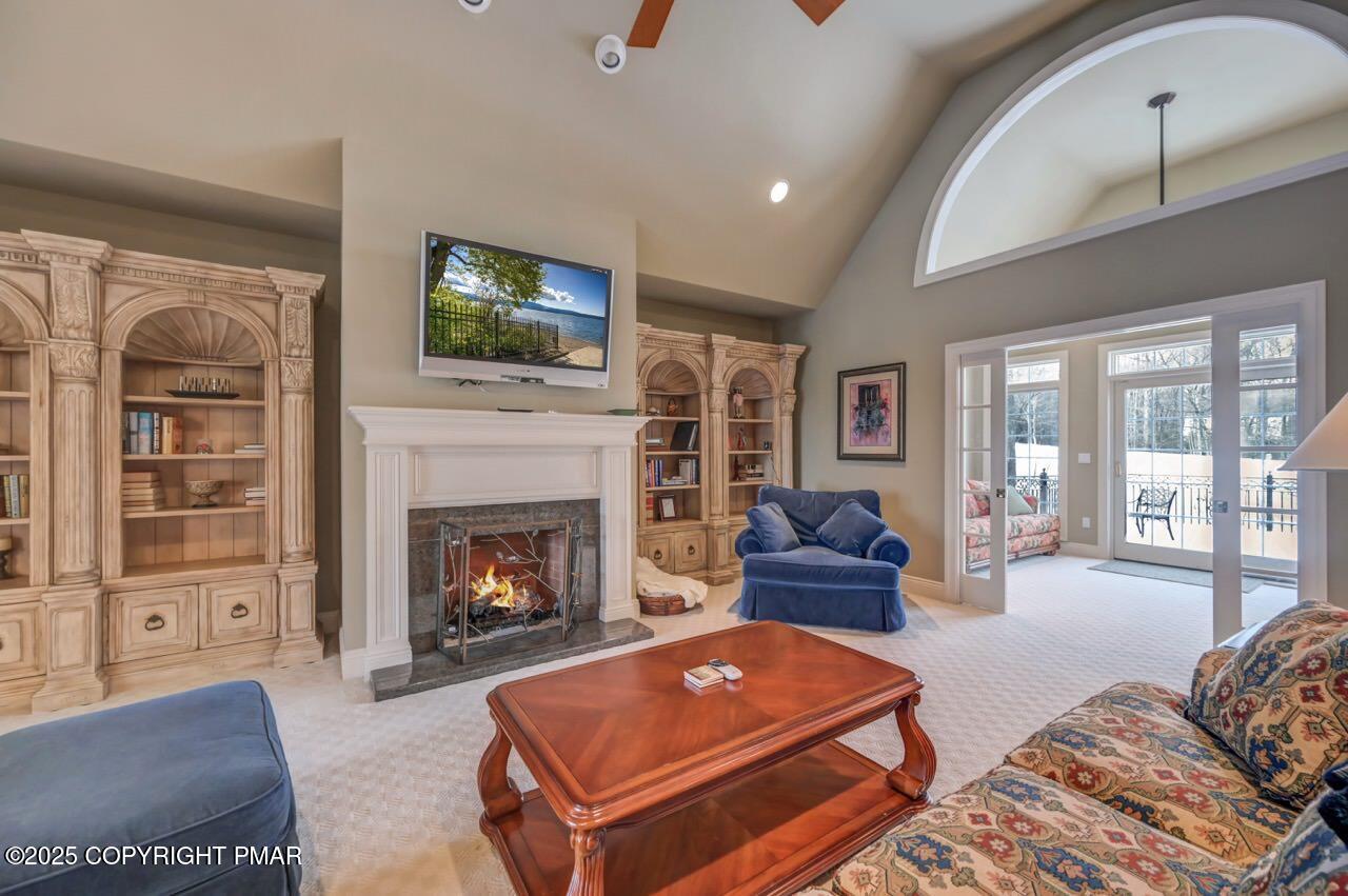 235 Wolf Hollow Road Lake Harmony, PA 18624 - Photo 20 of 96 a living room with furniture and a fireplace