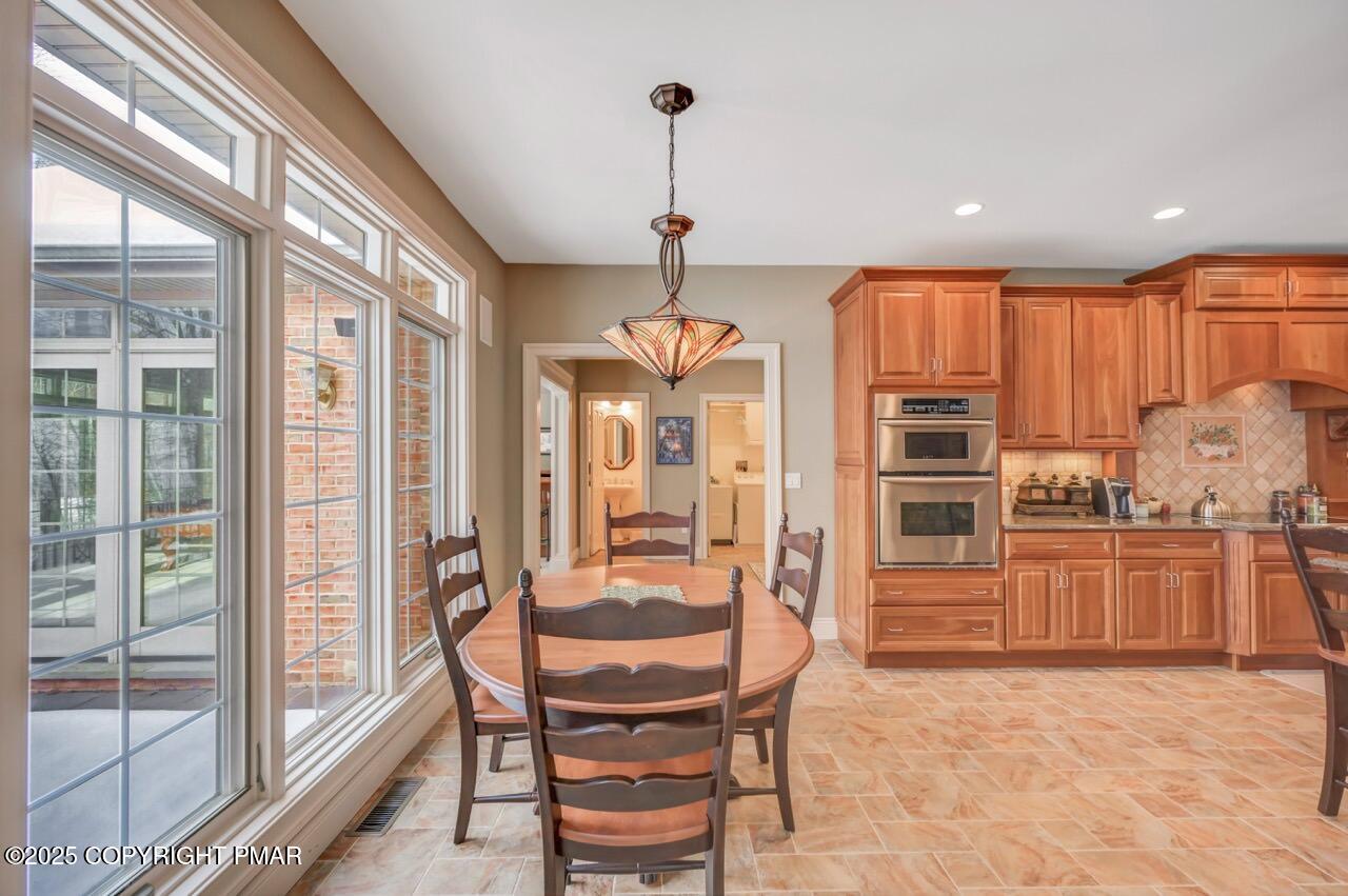 235 Wolf Hollow Road Lake Harmony, PA 18624 - Photo 25 of 98 a dining room with furniture and window