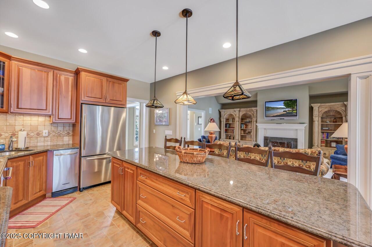 235 Wolf Hollow Road Lake Harmony, PA 18624 - Photo 32 of 96 a kitchen with stainless steel appliances granite countertop a refrigerator a sink and dishwasher