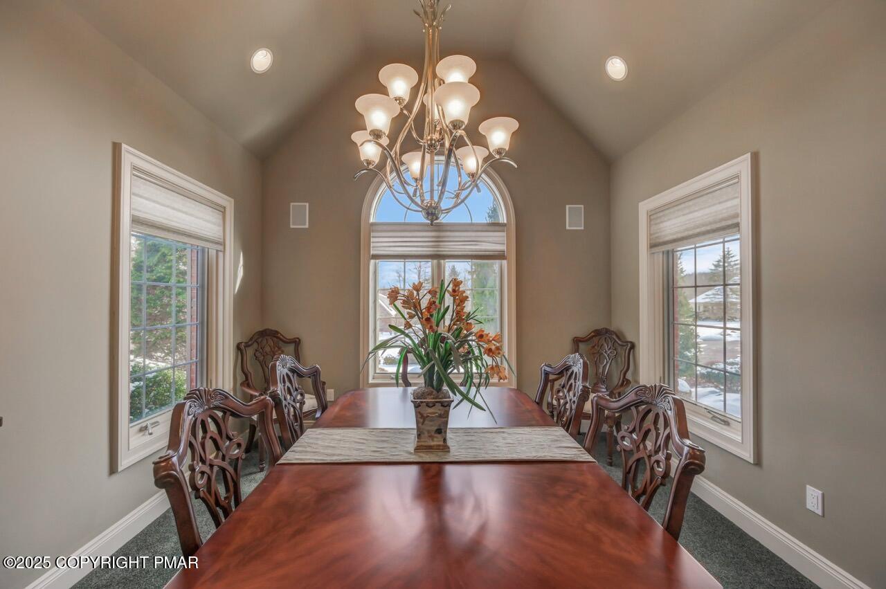 235 Wolf Hollow Road Lake Harmony, PA 18624 - Photo 38 of 98 a view of a dining room with furniture wooden floor and chandelier