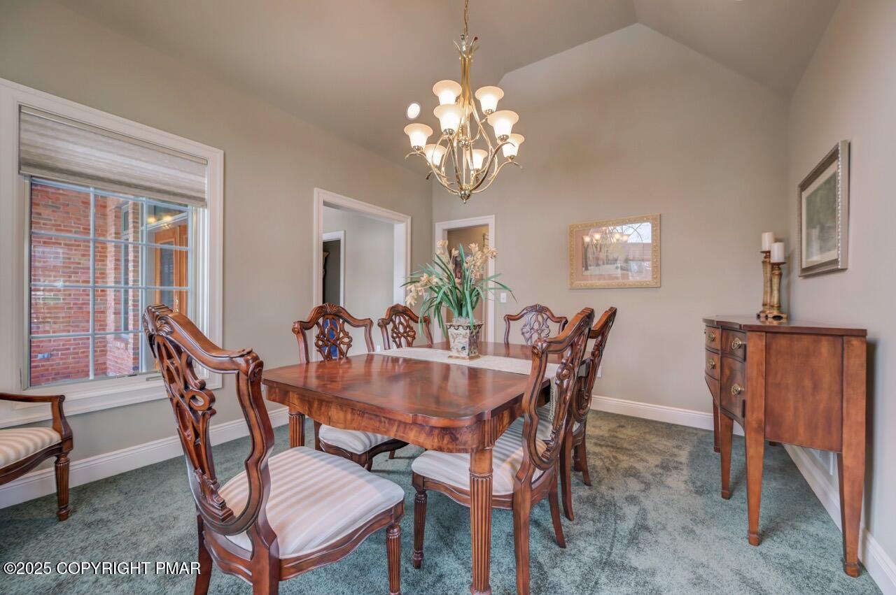235 Wolf Hollow Road Lake Harmony, PA 18624 - Photo 40 of 98 a dining room with furniture a chandelier and window