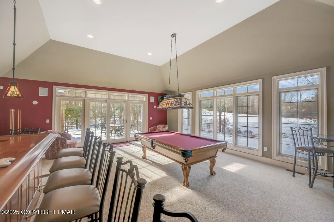 235 Wolf Hollow Road Lake Harmony, PA 18624 - Photo 43 of 96 a living room with furniture a flat screen tv and a large window