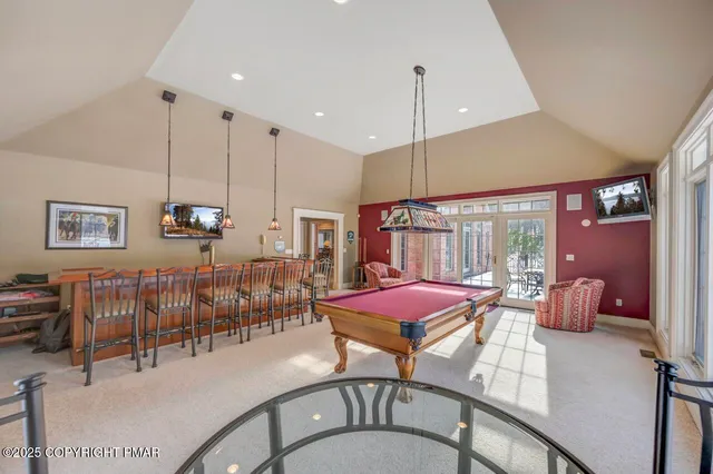 a view of a patio with iron fence