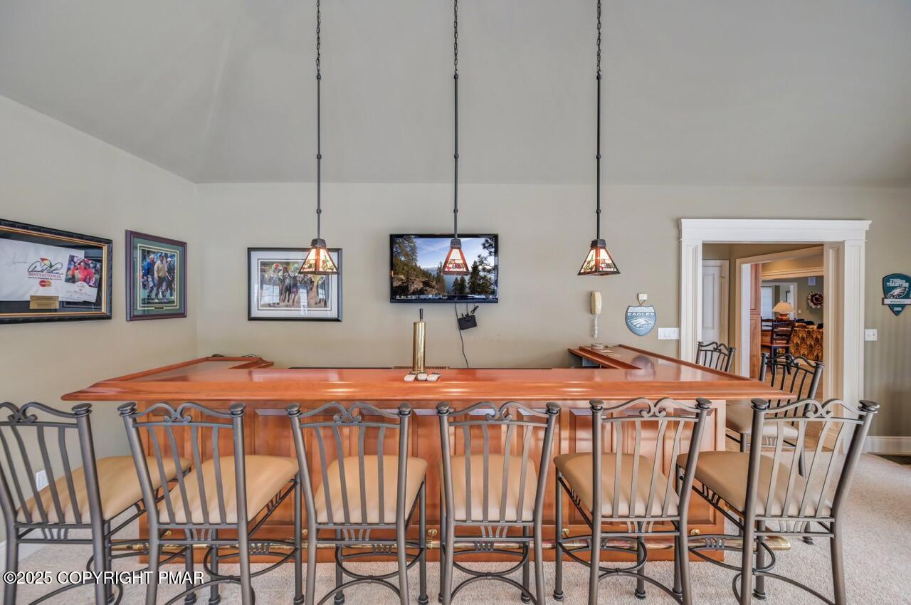 235 Wolf Hollow Road Lake Harmony, PA 18624 - Photo 47 of 98 a dining room with a table and chairs