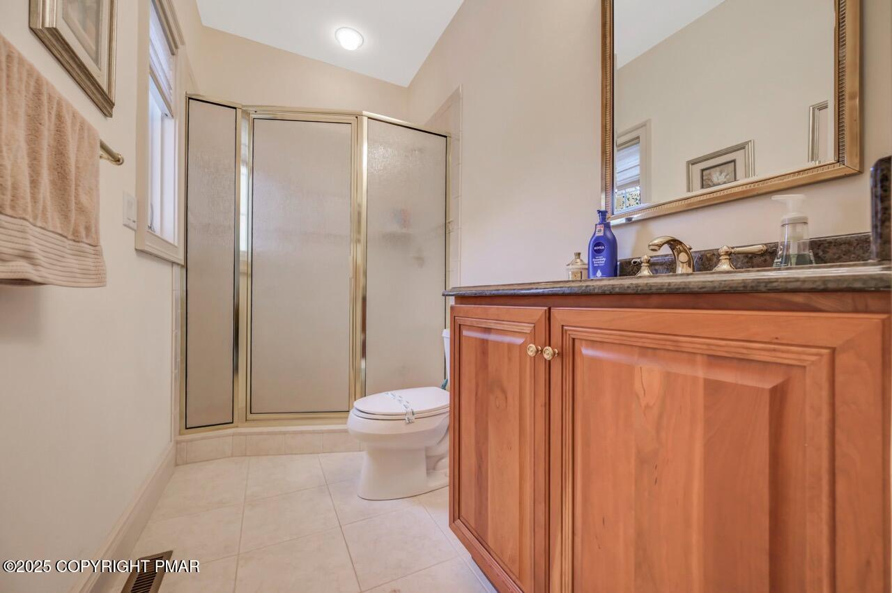 235 Wolf Hollow Road Lake Harmony, PA 18624 - Photo 62 of 98 a bathroom with a sink a toilet and shower