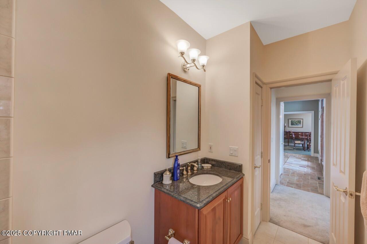 235 Wolf Hollow Road Lake Harmony, PA 18624 - Photo 63 of 98 a bathroom with a sink and a mirror