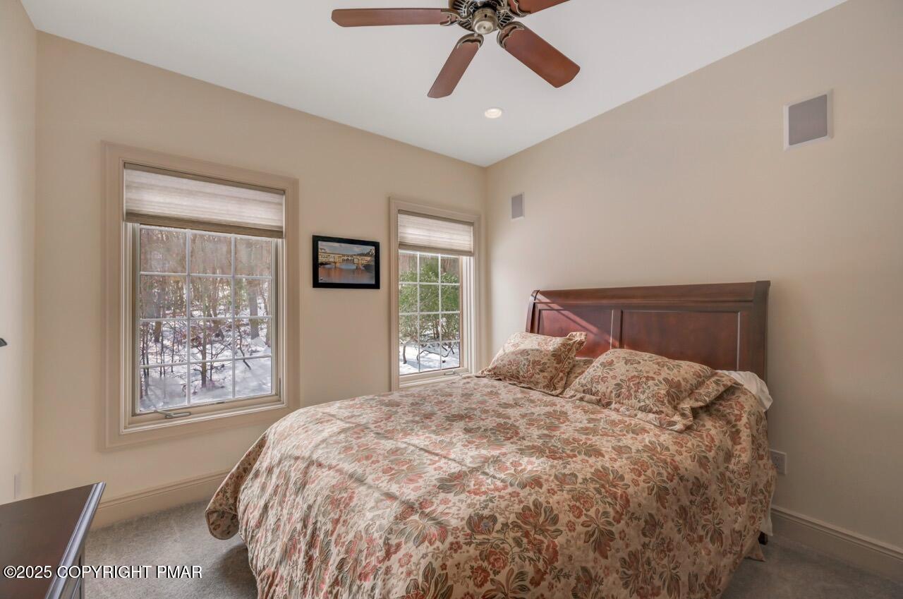 235 Wolf Hollow Road Lake Harmony, PA 18624 - Photo 63 of 96 a bedroom with a large bed and a window