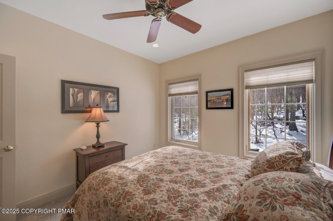 235 Wolf Hollow Road Lake Harmony, PA 18624 - Photo 66 of 98 a bedroom with a bed and a window