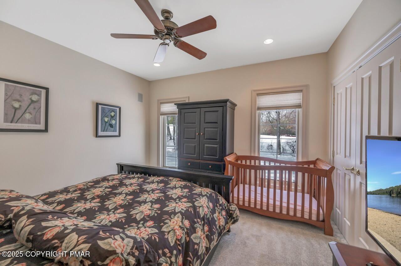 235 Wolf Hollow Road Lake Harmony, PA 18624 - Photo 68 of 98 a bedroom with a bed and a window