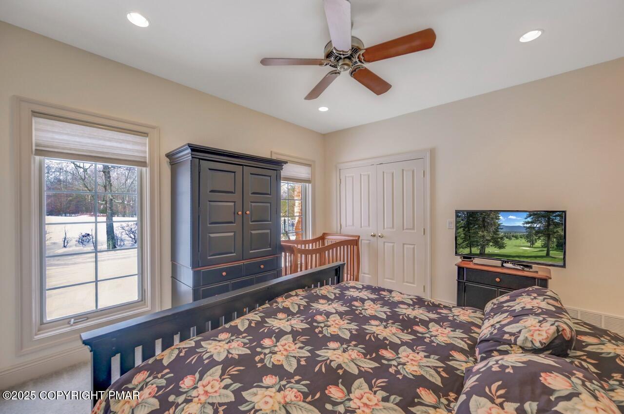 235 Wolf Hollow Road Lake Harmony, PA 18624 - Photo 71 of 98 a bedroom with a bed and a tv on dresser