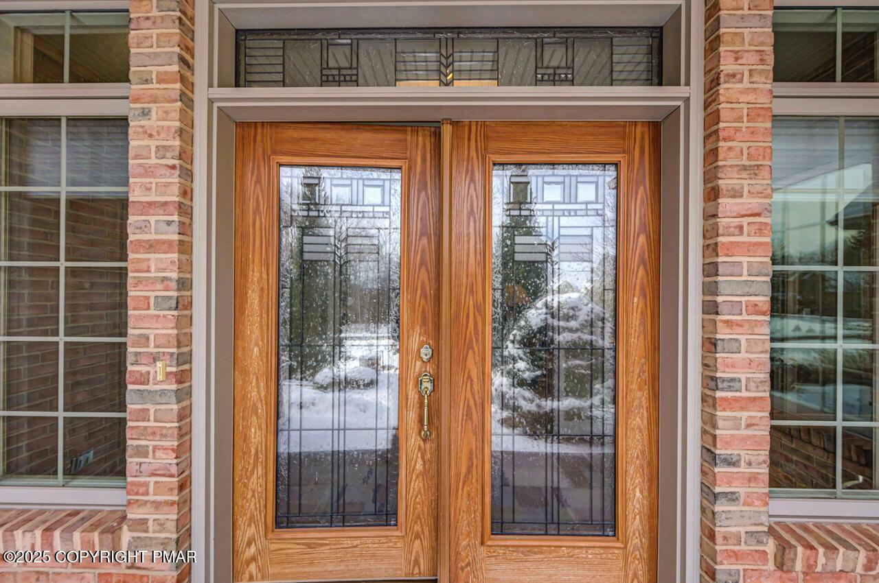 235 Wolf Hollow Road Lake Harmony, PA 18624 - Photo 10 of 96 a view of a brick house with front door