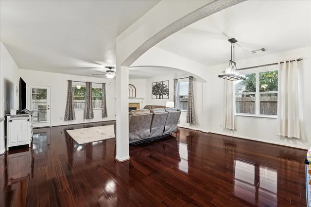 a living room with furniture window and wooden floor