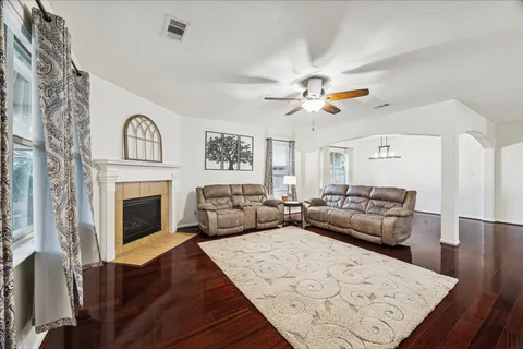 a living room with furniture and a fireplace