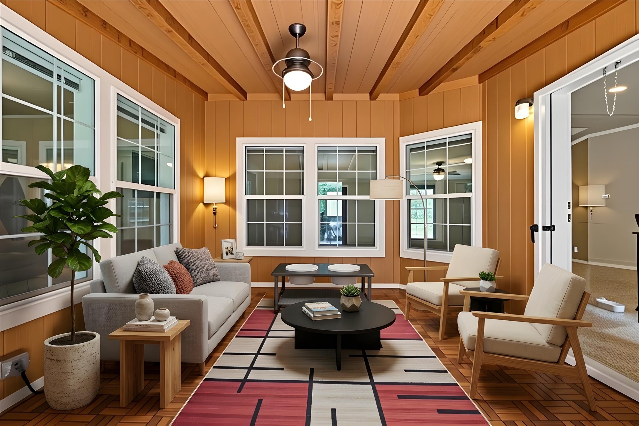 1024 Sand Hills Road Red Rock, TX 78662 - Photo 22 of 40 Virtually staged - Sunroom boasting rich wood paneling, exposed beam ceilings, and a geometric wood floor.