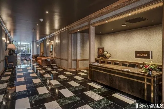 a kitchen with a checkered floor and white cabinets