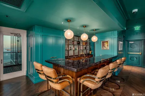 a room with furniture and a large mirror