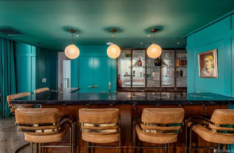 a kitchen with a table and chairs