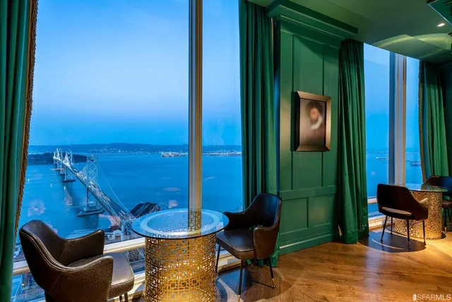 a bathroom with a toilet mirror and sink