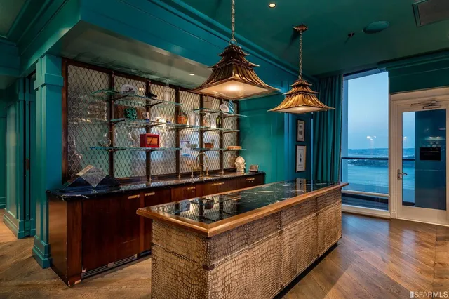 a view of outdoor kitchen and outdoor seating