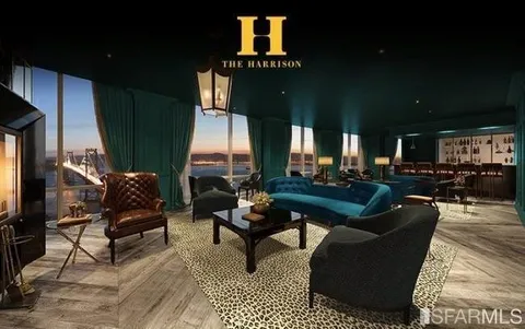 a living room with furniture a rug and a fireplace