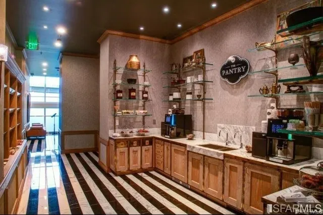 a kitchen with stainless steel appliances kitchen island granite countertop a sink and cabinets