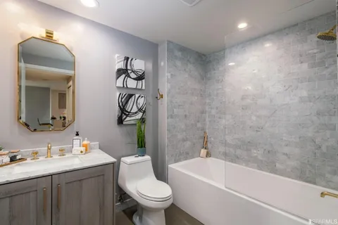 a bathroom with a sink a toilet and a bathtub