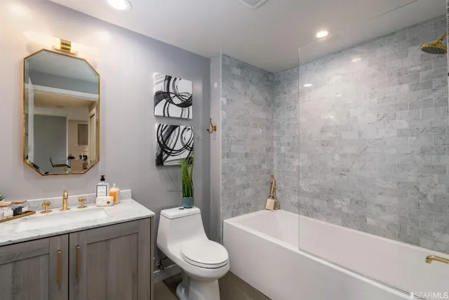 a bathroom with a sink a toilet and a bathtub