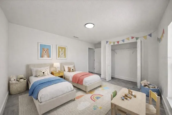 a bedroom with two beds and a dresser