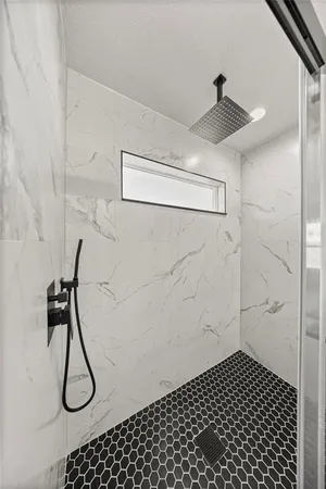 a view of a room with wooden floor