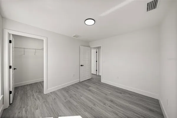 a bathroom with a double vanity sink mirror and toilet