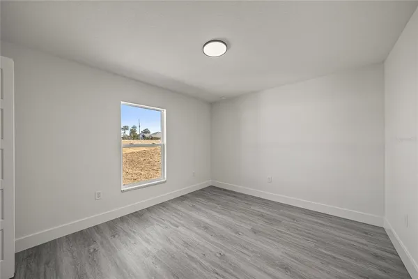 a bedroom with a bed and a table