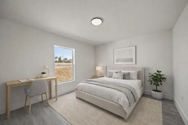 an empty room with wooden floor and closet