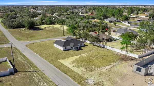 a view of a swimming pool with a yard