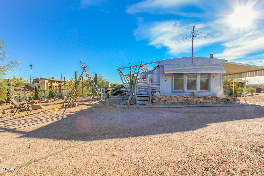 178 North Starr Road Apache Junction, AZ 85119 - Photo 1 of 41 a front view of a house with a yard