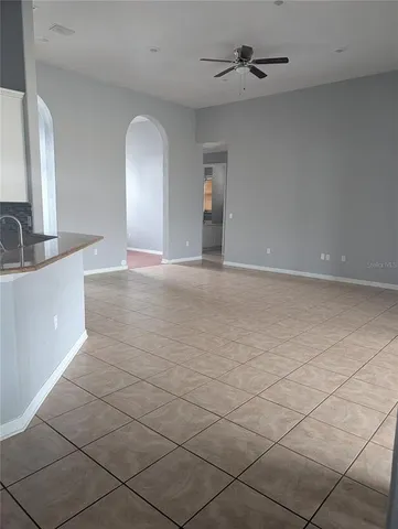 a view of a kitchen with a sink and cabinets