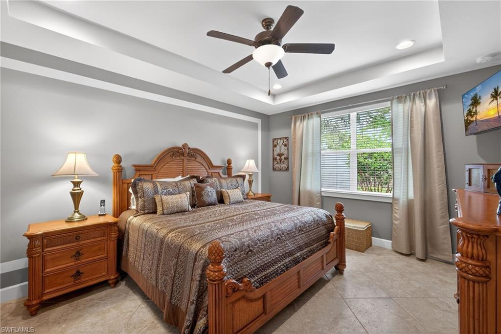 20105 Torch Key Way Estero, FL 33928 - Photo 13 of 29 a bedroom with a bed and a chandelier