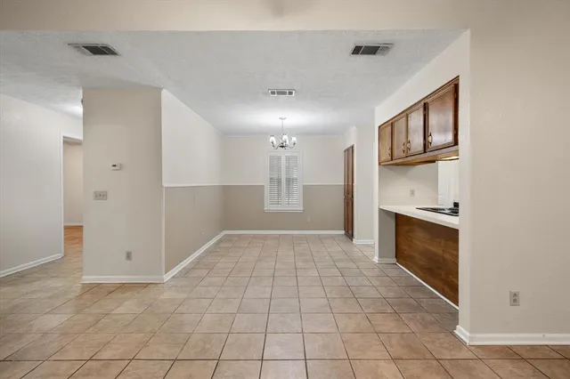 a kitchen with stainless steel appliances a refrigerator and microwave