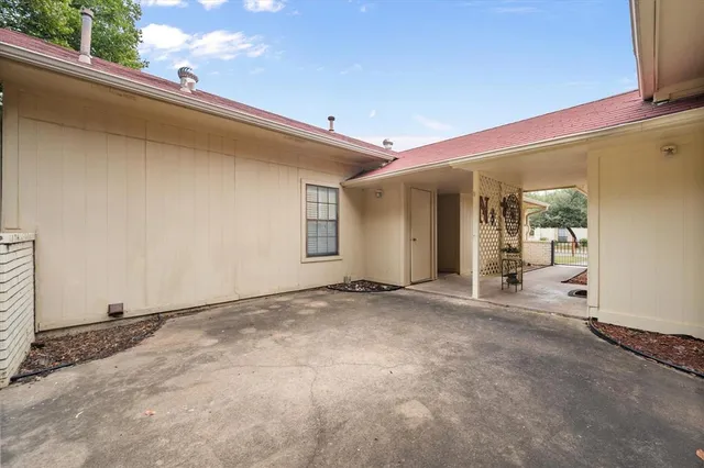 an aerial view of a house with yard and outdoor space